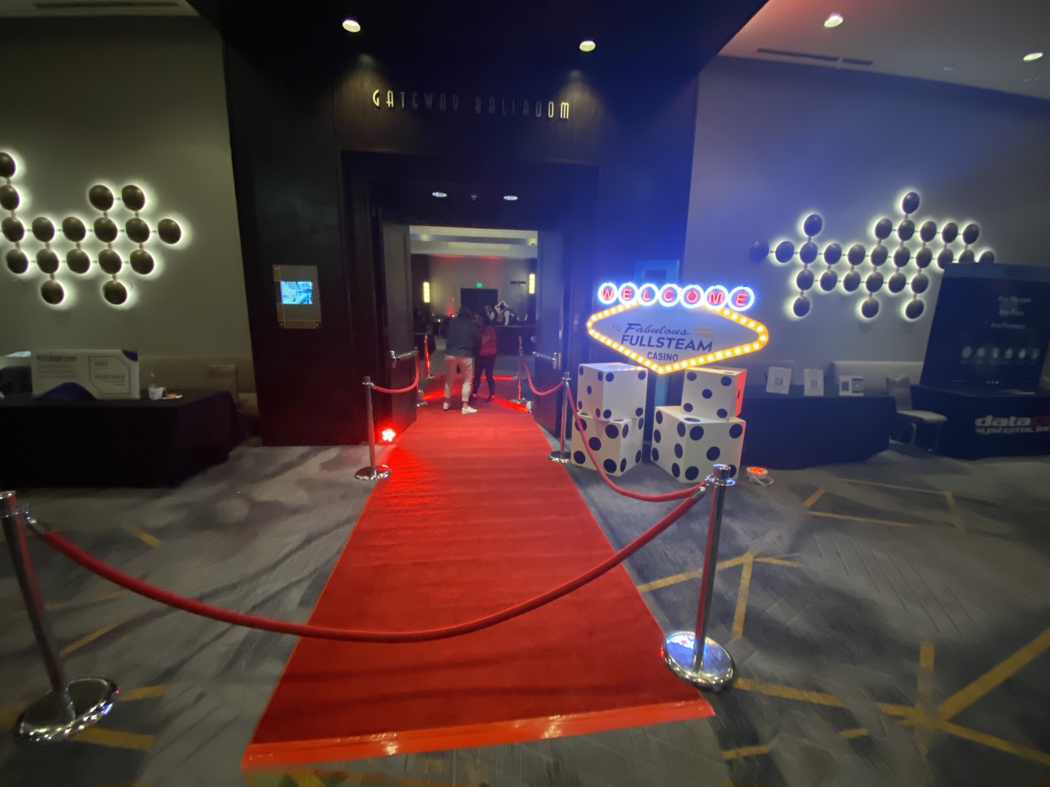 Red carpet casino entrance with illuminated décor